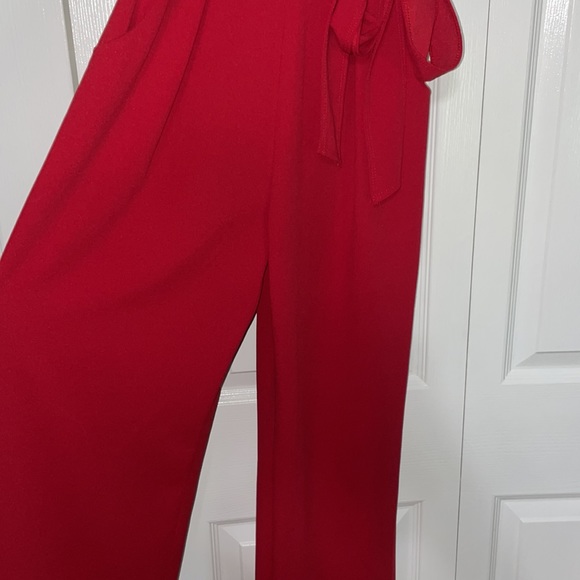 Red Jumpsuit with belted waist and ruffle sleeves - Picture 4 of 7